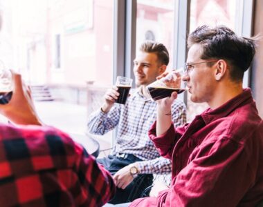 group-men-drinking-beer-bar_23-2148154067